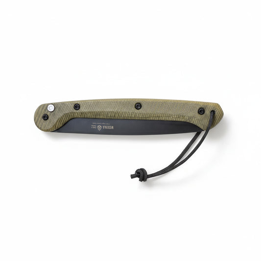 Folding saw with a green micarta handle and black blade on a white background